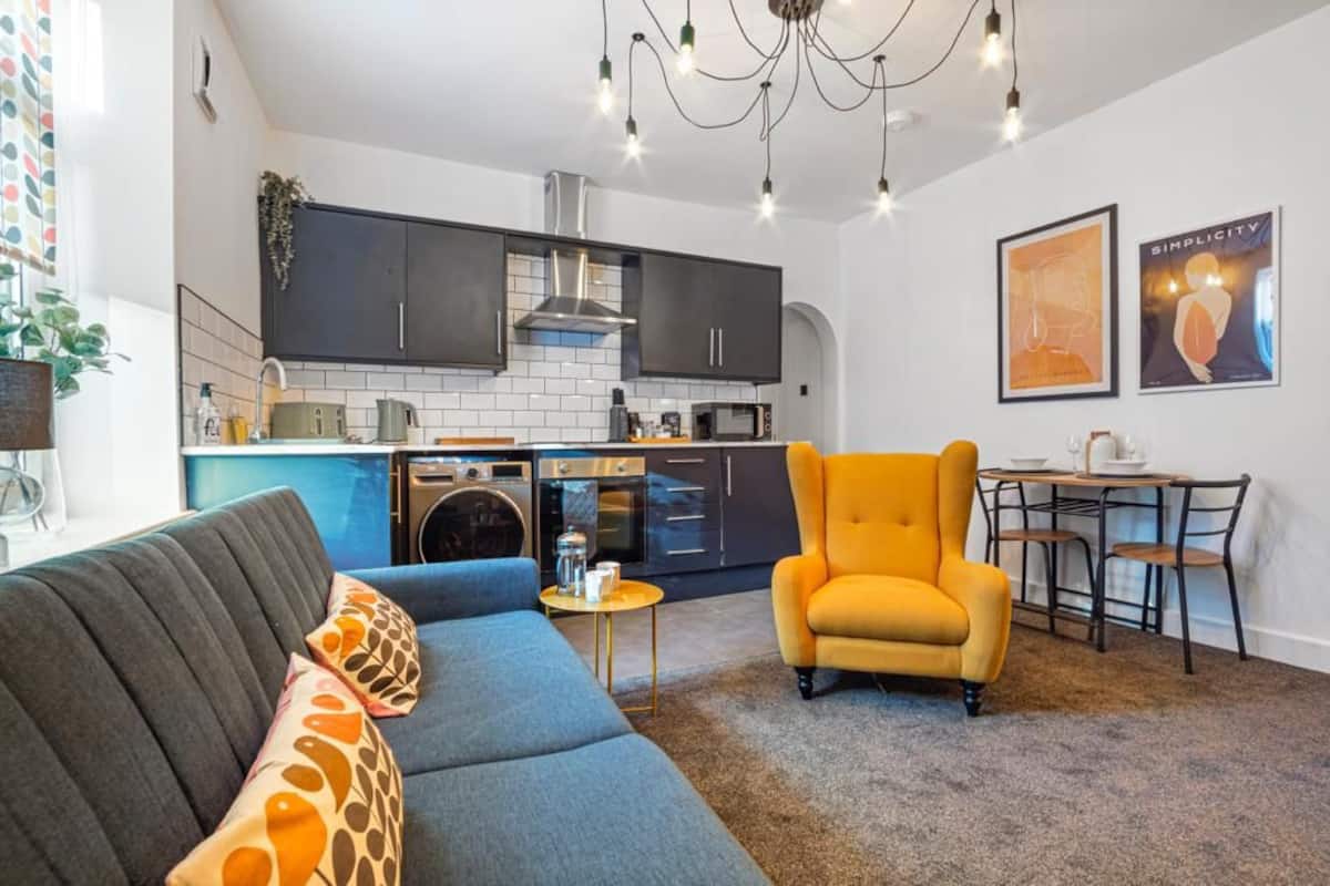 Open plan kitchen and lounge at the Old Mill Lane apartment